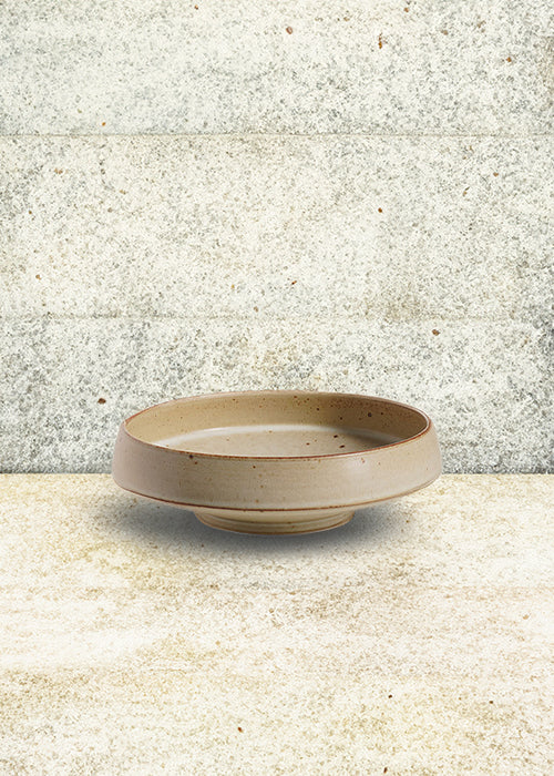 Handmade stoneware wide dish, measuring W19cm x H5cm. A trio of stoneware minimalism, including a flat, deep, and wide dish, each representing timelessness. Perfect for culinary creations, the Stone Dish Set offers versatility and beauty where simplistic design meets functionality.