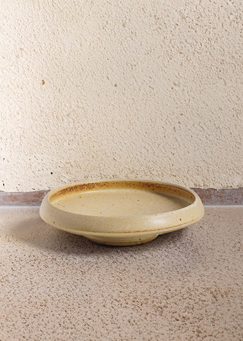 Handmade stoneware flat dish, measuring W16.5cm x H4.3cm. A trio of stoneware minimalism, including a flat, deep, and wide dish, each representing timelessness. Perfect for culinary creations, the Stone Dish Set offers versatility and beauty where simplistic design meets functionality