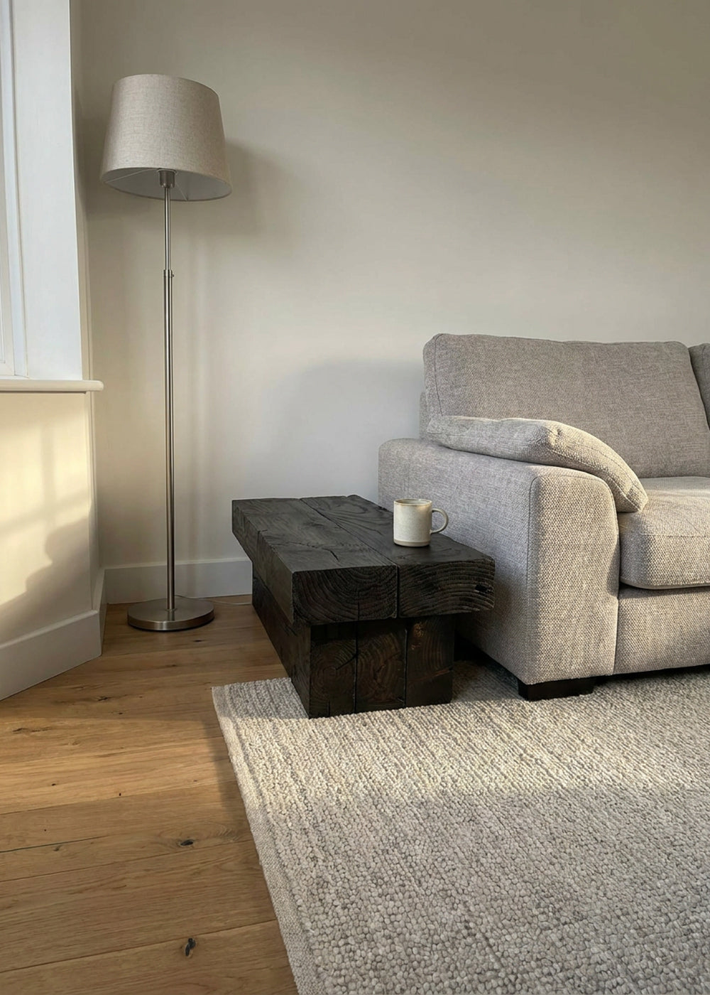 Kura plinth table in a living room