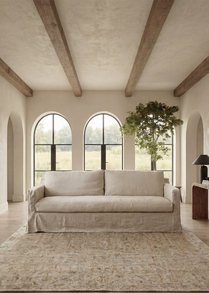 Wabi Milk White linen two seater sofa in a living room