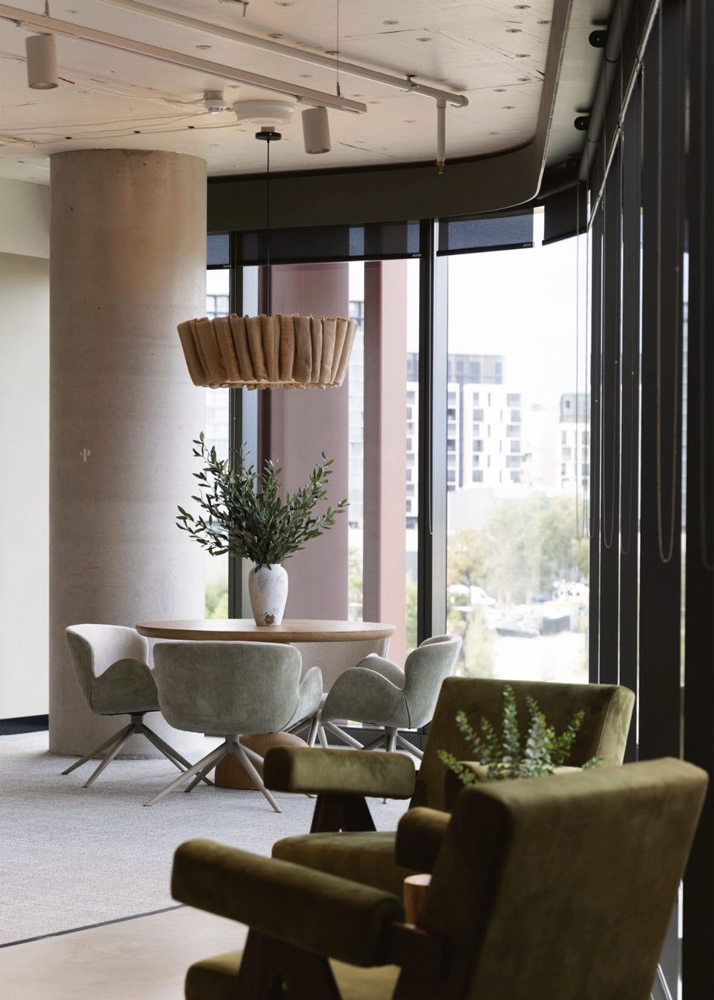 Linen Wave linen pendant above a round meeting table and sage velvet chairs in a Sydney high-rise workspace