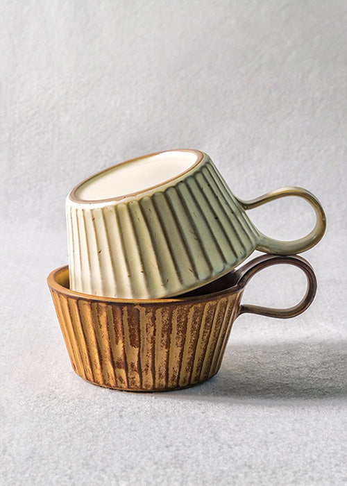 Captivating mugs embodying a fusion of aged beauty. Dubbed 'Weathered Elegance,' these distinctive mugs boast an intriguing, acid-washed effect, evoking the appearance of having braved the elements over time. Available in both dark and light variations, these mugs emanate character and history, reminiscent of vessels that have carried stories through the ages. Offering a harmonious blend of old-world charm and contemporary appeal, they stand as unique pieces with a timeless allure