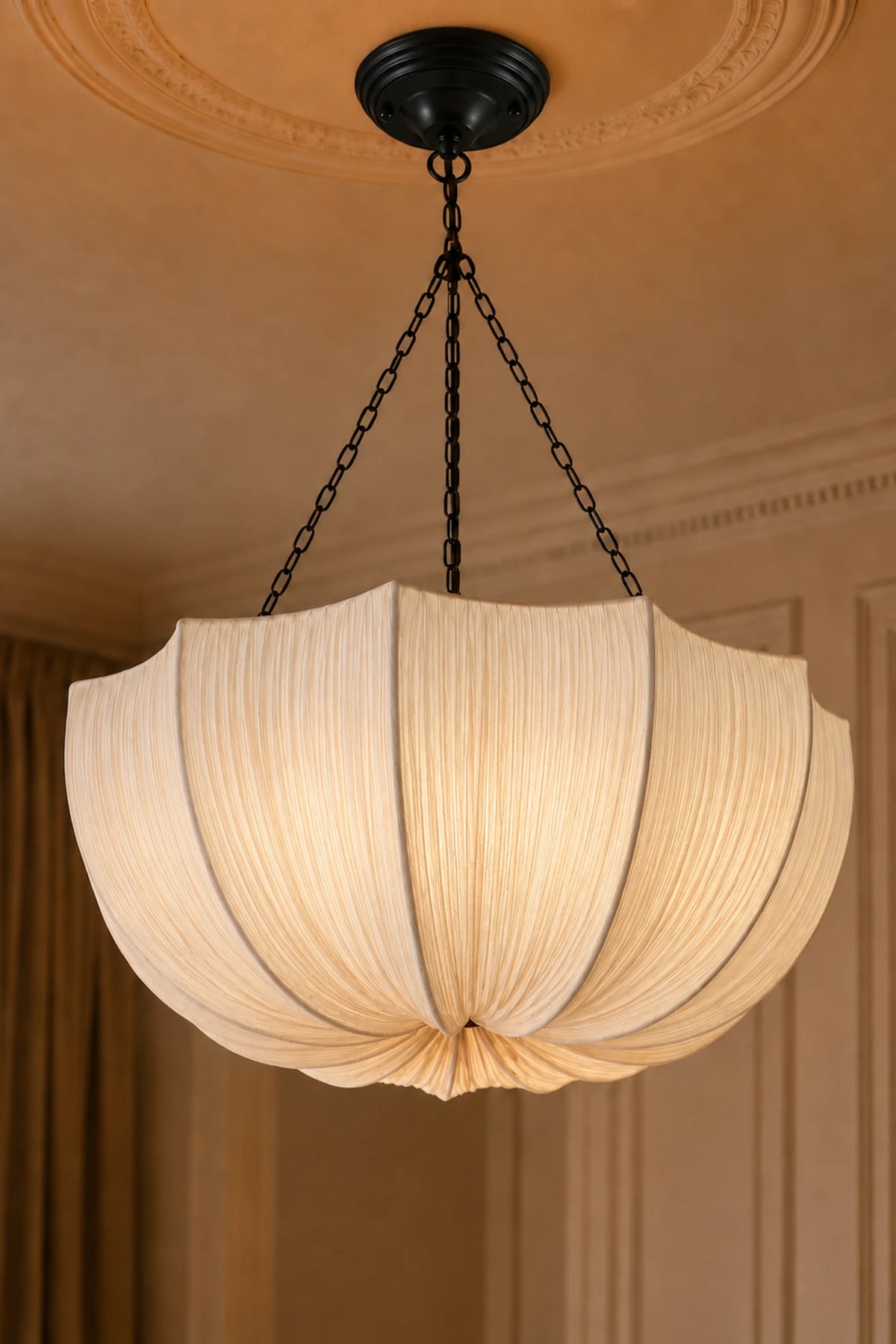 Kumo fabric pendant light hanging on a black chain beneath a ceiling rose