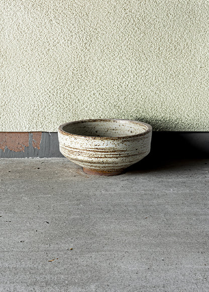 Handmade stone tapered dish, measuring W11.7cm x H5.5cm. Featuring a rugged yet sleek style, this dish is part of a comprehensive set of raw pottery dishes and mugs designed for versatile dining needs.